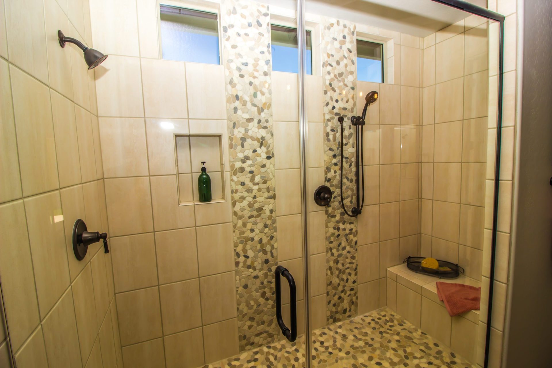 Master Bedroom Tiled Shower With Two Shower Heads And Sitting Bench